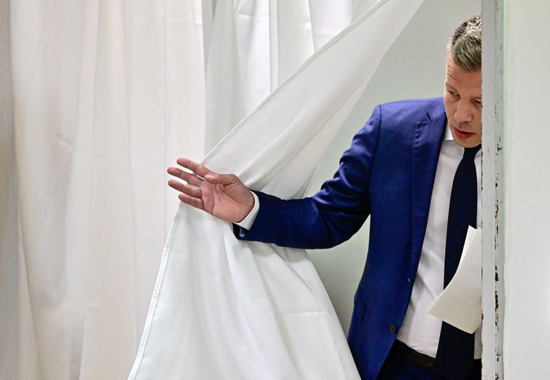 Hungary’s opposition leader ‘optimistic’ after final opinion polls put his party in lead